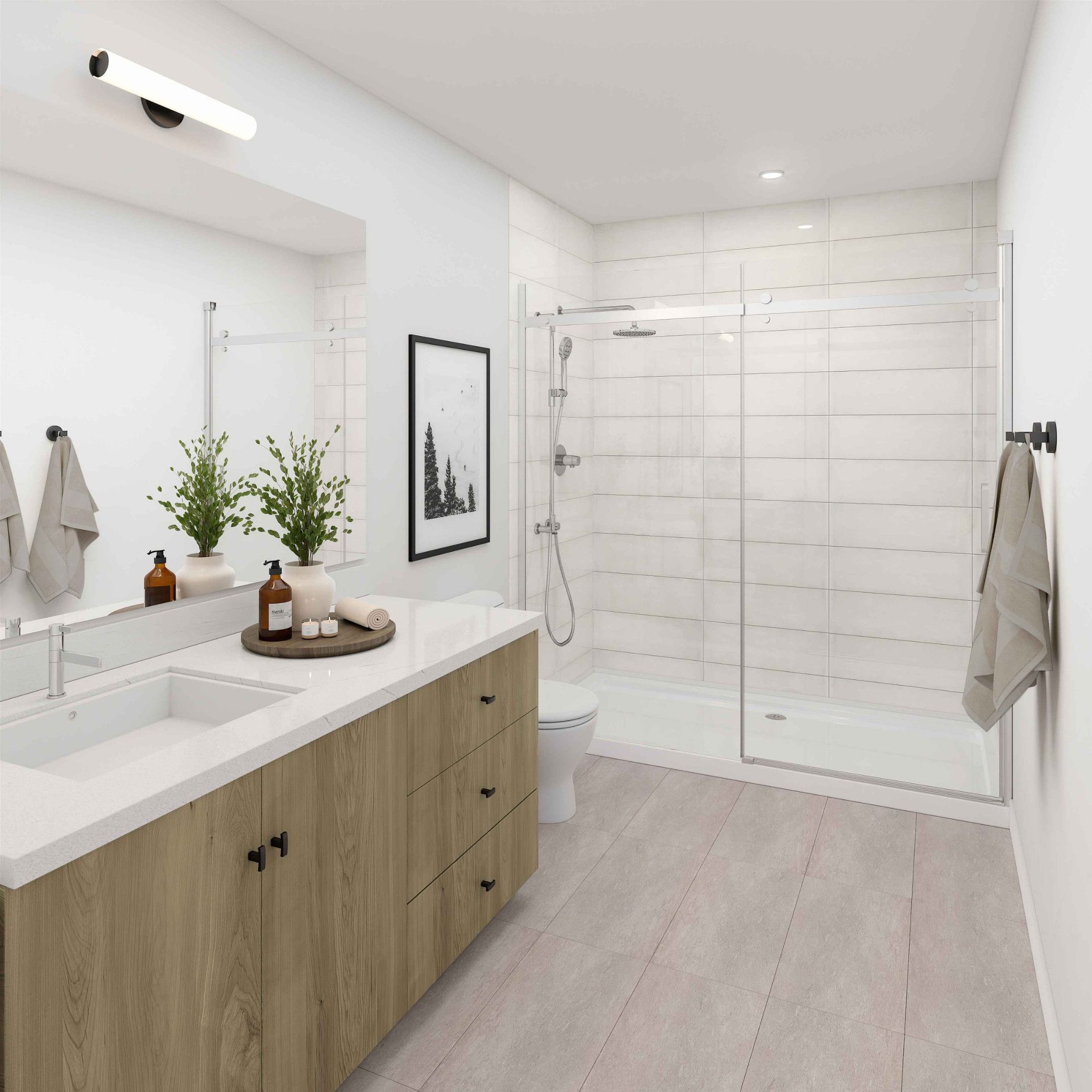 Contemporary bathroom design featuring a beautiful vanity with large-format tile, and frameless glass shower enclosure. Modern fixtures and layout to maximize space efficiency.
